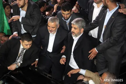 Hamas leader Khaled Meshaal visits the home of the al-Dallu family, which destroyed by an Israeli airstrike on November 24 and several members of the al-Dallu family - five of them children - and two of their neighbours...
