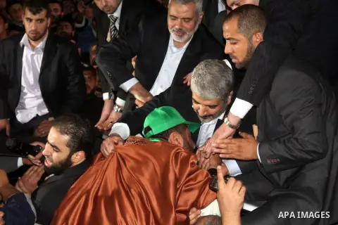Hamas leader Khaled Meshaal visits the home of the al-Dallu family, which destroyed by an Israeli airstrike on November 24 and several members of the al-Dallu family - five of them children - and two of their neighbours...