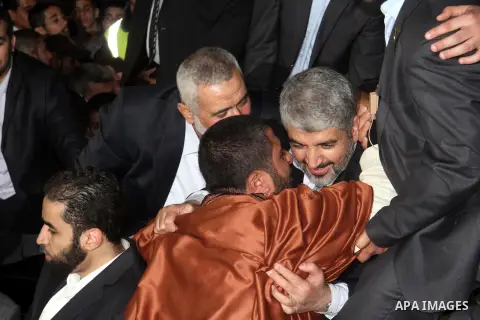 Hamas leader Khaled Meshaal visits the home of the al-Dallu family, which destroyed by an Israeli airstrike on November 24 and several members of the al-Dallu family - five of them children - and two of their neighbours...