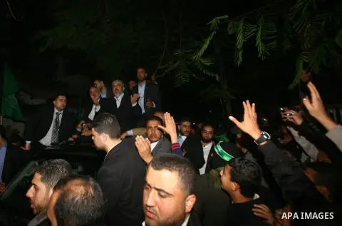 Hamas leader Khaled Meshaal visits the home of the al-Dallu family, which destroyed by an Israeli airstrike on November 24 and several members of the al-Dallu family - five of them children - and two of their neighbours...