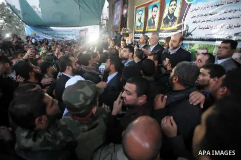 Hamas leader Khaled Meshaal visits the home of the late Hamas military commander Ahmed Al-Jaabari, who was killed in an Israeli air strike, in Gaza city on December 7, 2012. Meshaal is making his first-ever visit to the...