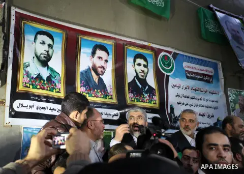 Hamas leader Khaled Meshaal visits the home of the late Hamas military commander Ahmed Al-Jaabari, who was killed in an Israeli air strike, in Gaza city on December 7, 2012. Meshaal is making his first-ever visit to the...
