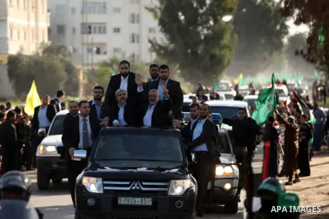 Hamas chief Khaled Meshaal, riding in a car with Palestinian prime minister in Gaza Strip Ismail Haniyeh, during a visit to the house of Ahmed Jaabari, the late leader of the Hamas armed wing who was killed in an Israeli...
