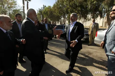 Hamas prime minister Ismail Haniya shows Haniya greeting Palestinian Hamas leader in exile Khaled Meshaal upon the latter's arrival in the Gaza Strip from the Rafah border crossing on December 7, 2012. Meshaal made his f...