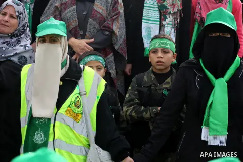 Palestinian Hamas supporters gather to attend a Hamas rally marking the 25th anniversary of the Islamist movement's founding in Gaza City on December 8, 2012. Hamas chief Khaled Meshaal arrived to Gaza strip on December...