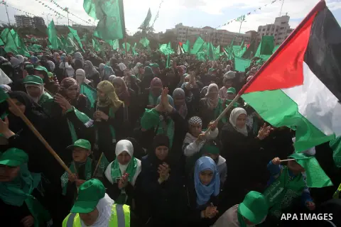 Palestinian Hamas supporters gather to attend a Hamas rally marking the 25th anniversary of the Islamist movement's founding in Gaza City on December 8, 2012. Hamas chief Khaled Meshaal arrived to Gaza strip on December...