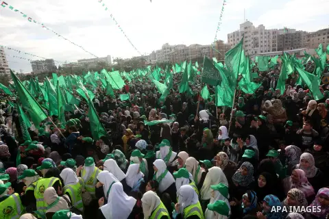 Palestinian Hamas supporters gather to attend a Hamas rally marking the 25th anniversary of the Islamist movement's founding in Gaza City on December 8, 2012. Hamas chief Khaled Meshaal arrived to Gaza strip on December...