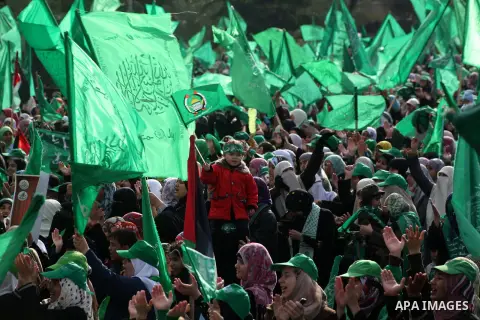 Palestinian Hamas supporters gather to attend a Hamas rally marking the 25th anniversary of the Islamist movement's founding in Gaza City on December 8, 2012. Hamas chief Khaled Meshaal arrived to Gaza strip on December...