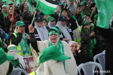 Palestinian Hamas supporters gather to attend a Hamas rally marking the 25th anniversary of the Islamist movement's founding in Gaza City on December 8, 2012. Hamas chief Khaled Meshaal arrived to Gaza strip on December...