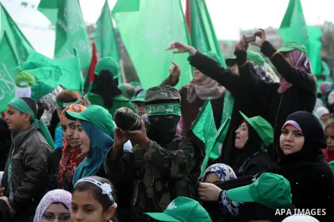 Palestinian Hamas supporters gather to attend a Hamas rally marking the 25th anniversary of the Islamist movement's founding in Gaza City on December 8, 2012. Hamas chief Khaled Meshaal arrived to Gaza strip on December...