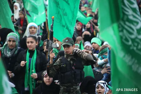 Palestinian Hamas supporters gather to attend a Hamas rally marking the 25th anniversary of the Islamist movement's founding in Gaza City on December 8, 2012. Hamas chief Khaled Meshaal arrived to Gaza strip on December...