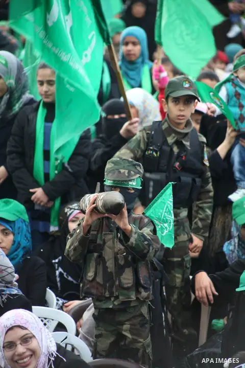 Palestinian Hamas supporters gather to attend a Hamas rally marking the 25th anniversary of the Islamist movement's founding in Gaza City on December 8, 2012. Hamas chief Khaled Meshaal arrived to Gaza strip on December...