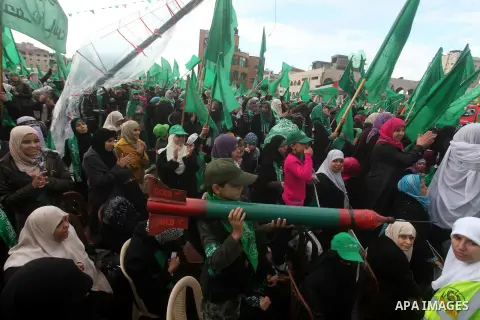 Palestinian Hamas supporters gather to attend a Hamas rally marking the 25th anniversary of the Islamist movement's founding in Gaza City on December 8, 2012. Hamas chief Khaled Meshaal arrived to Gaza strip on December...