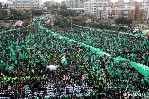 Palestinian Hamas supporters gather to attend a Hamas rally marking the 25th anniversary of the Islamist movement's founding in Gaza City on December 8, 2012. Hamas chief Khaled Meshaal arrived to Gaza strip on December...