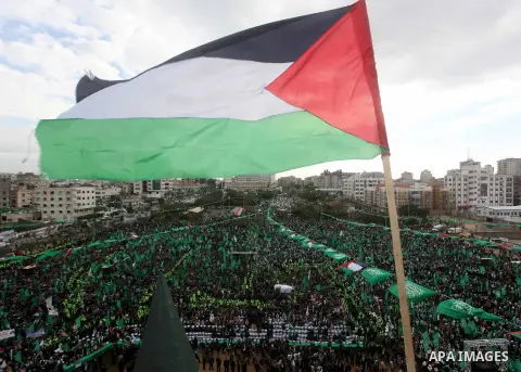 Palestinian Hamas supporters gather to attend a Hamas rally marking the 25th anniversary of the Islamist movement's founding in Gaza City on December 8, 2012. Hamas chief Khaled Meshaal arrived to Gaza strip on December...
