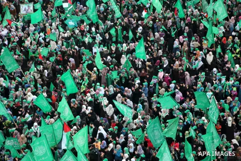 Palestinian Hamas supporters gather to attend a Hamas rally marking the 25th anniversary of the Islamist movement's founding in Gaza City on December 8, 2012. Hamas chief Khaled Meshaal arrived to Gaza strip on December...