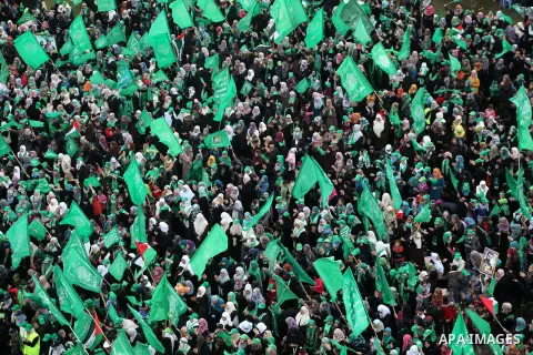 Palestinian Hamas supporters gather to attend a Hamas rally marking the 25th anniversary of the Islamist movement's founding in Gaza City on December 8, 2012. Hamas chief Khaled Meshaal arrived to Gaza strip on December...
