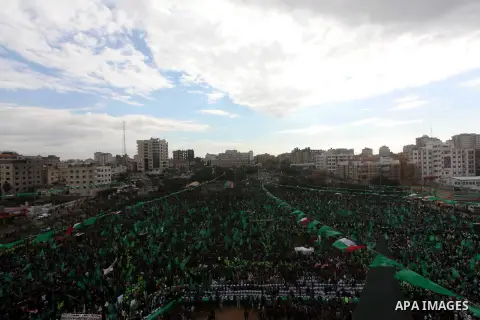 Palestinian Hamas supporters gather to attend a Hamas rally marking the 25th anniversary of the Islamist movement's founding in Gaza City on December 8, 2012. Hamas chief Khaled Meshaal arrived to Gaza strip on December...