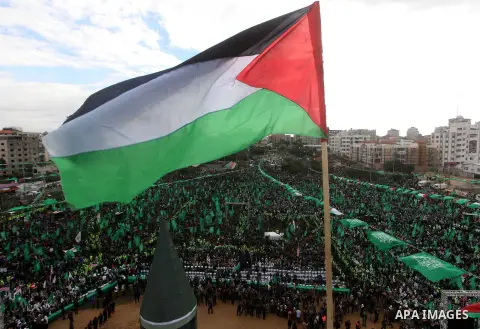 Palestinian Hamas supporters gather to attend a Hamas rally marking the 25th anniversary of the Islamist movement's founding in Gaza City on December 8, 2012. Hamas chief Khaled Meshaal arrived to Gaza strip on December...