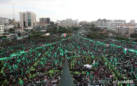 Palestinian Hamas supporters gather to attend a Hamas rally marking the 25th anniversary of the Islamist movement's founding in Gaza City on December 8, 2012. Hamas chief Khaled Meshaal arrived to Gaza strip on December...