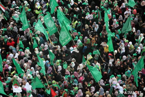 Palestinian Hamas supporters gather to attend a Hamas rally marking the 25th anniversary of the Islamist movement's founding in Gaza City on December 8, 2012. Hamas chief Khaled Meshaal arrived to Gaza strip on December...