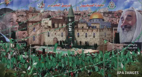 Palestinian Hamas supporters attend a Hamas rally marking the 25th anniversary of the Islamist movement's founding in Gaza City on December 8, 2012. Hamas chief Khaled Meshaal arrived to Gaza strip on December 7 during h...