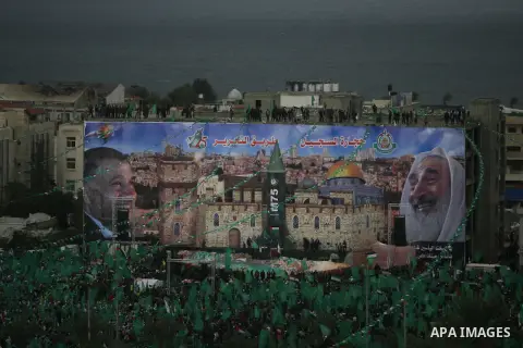 Palestinian Hamas supporters attend a Hamas rally marking the 25th anniversary of the Islamist movement's founding in Gaza City on December 8, 2012. Hamas chief Khaled Meshaal arrived to Gaza strip on December 7 during h...