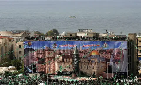 Palestinian Hamas supporters attend a Hamas rally marking the 25th anniversary of the Islamist movement's founding in Gaza City on December 8, 2012. Hamas chief Khaled Meshaal arrived to Gaza strip on December 7 during h...