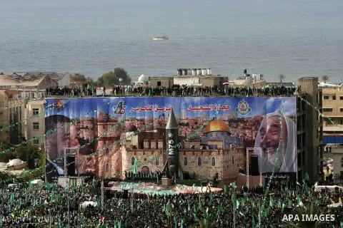 Palestinian Hamas supporters attend a Hamas rally marking the 25th anniversary of the Islamist movement's founding in Gaza City on December 8, 2012. Hamas chief Khaled Meshaal arrived to Gaza strip on December 7 during h...