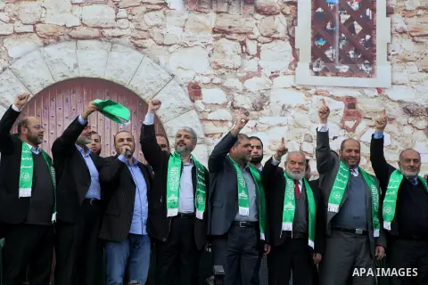 Hamas chief Khaled Meshaal, with senior Hamas leaders, takes part in a Hamas rally marking the 25th anniversary of the Islamist movement's founding in Gaza City on December 8, 2012. Meshaal arrived to Gaza strip on Decem...