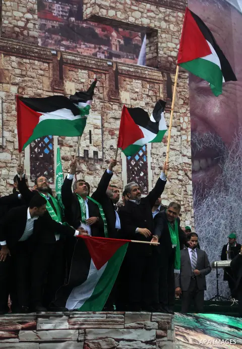 Hamas chief Khaled Meshaal, with senior Hamas leaders, takes part in a Hamas rally marking the 25th anniversary of the Islamist movement's founding in Gaza City on December 8, 2012. Meshaal arrived to Gaza strip on Decem...