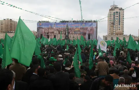 Palestinian Hamas supporters attend a Hamas rally marking the 25th anniversary of the Islamist movement's founding in Gaza City on December 8, 2012. Hamas chief Khaled Meshaal arrived to Gaza strip on December 7 during h...