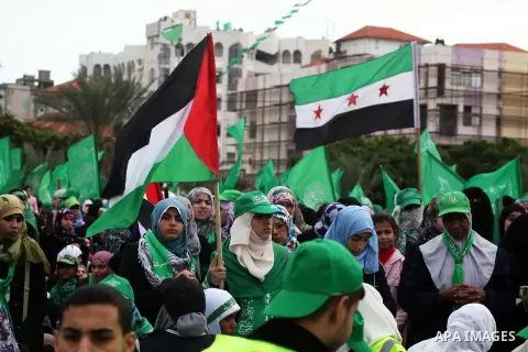 Palestinian Hamas supporters attend a Hamas rally marking the 25th anniversary of the Islamist movement's founding in Gaza City on December 8, 2012. Hamas chief Khaled Meshaal arrived to Gaza strip on December 7 during h...