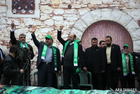 Hamas leader Mousa Abu Marzouq, with senior Hamas leaders, takes part in a Hamas rally marking the 25th anniversary of the Islamist movement's founding in Gaza City on December 8, 2012. Meshaal arrived to Gaza strip on D...
