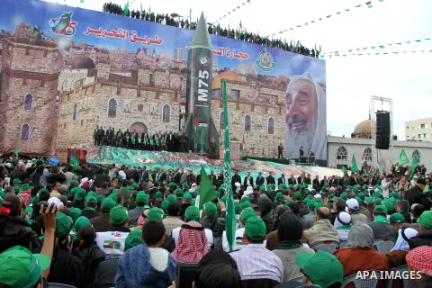 Palestinian Hamas supporters attend a Hamas rally marking the 25th anniversary of the Islamist movement's founding in Gaza City on December 8, 2012. Hamas chief Khaled Meshaal arrived to Gaza strip on December 7 during h...