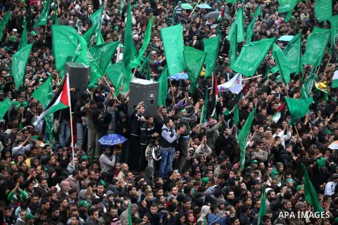 Palestinian Hamas supporters attend a Hamas rally marking the 25th anniversary of the Islamist movement's founding in Gaza City on December 8, 2012. Hamas chief Khaled Meshaal arrived to Gaza strip on December 7 during h...