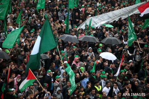 Palestinian Hamas supporters attend a Hamas rally marking the 25th anniversary of the Islamist movement's founding in Gaza City on December 8, 2012. Hamas chief Khaled Meshaal arrived to Gaza strip on December 7 during h...