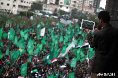 Palestinian Hamas supporters attend a Hamas rally marking the 25th anniversary of the Islamist movement's founding in Gaza City on December 8, 2012. Hamas chief Khaled Meshaal arrived to Gaza strip on December 7 during h...