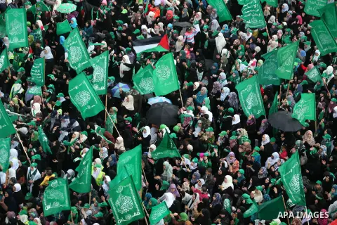Palestinian Hamas supporters attend a Hamas rally marking the 25th anniversary of the Islamist movement's founding in Gaza City on December 8, 2012. Hamas chief Khaled Meshaal arrived to Gaza strip on December 7 during h...
