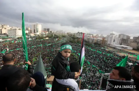 Palestinian Hamas supporters attend a Hamas rally marking the 25th anniversary of the Islamist movement's founding in Gaza City on December 8, 2012. Hamas chief Khaled Meshaal arrived to Gaza strip on December 7 during h...