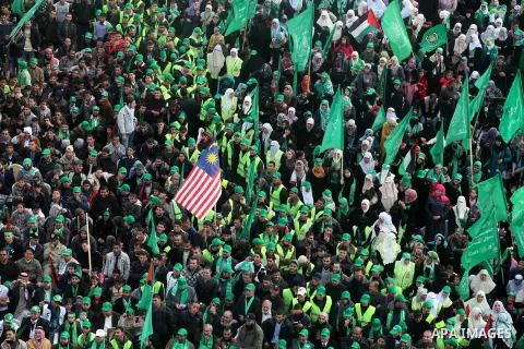 Palestinian Hamas supporters attend a Hamas rally marking the 25th anniversary of the Islamist movement's founding in Gaza City on December 8, 2012. Hamas chief Khaled Meshaal arrived to Gaza strip on December 7 during h...