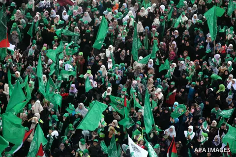 Palestinian Hamas supporters attend a Hamas rally marking the 25th anniversary of the Islamist movement's founding in Gaza City on December 8, 2012. Hamas chief Khaled Meshaal arrived to Gaza strip on December 7 during h...