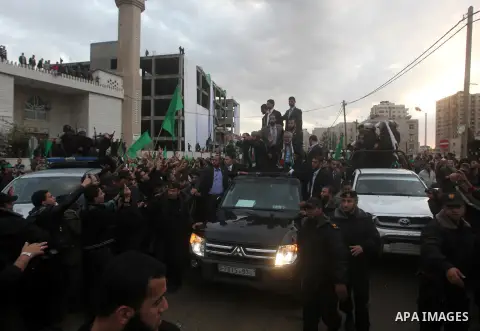 Hamas chief Khaled Meshaal, with senior Hamas leaders, takes part in a Hamas rally marking the 25th anniversary of the Islamist movement's founding in Gaza City on December 8, 2012. Meshaal arrived to Gaza strip on Decem...