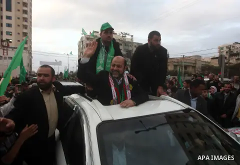 Hamas leader Mousa Abu Marzouq takes part in a Hamas rally marking the 25th anniversary of the Islamist movement's founding in Gaza City on December 8, 2012. Meshaal arrived to Gaza strip on December 7 during his first-e...