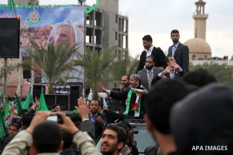 Hamas chief Khaled Meshaal, with senior Hamas leaders, takes part in a Hamas rally marking the 25th anniversary of the Islamist movement's founding in Gaza City on December 8, 2012. Meshaal arrived to Gaza strip on Decem...