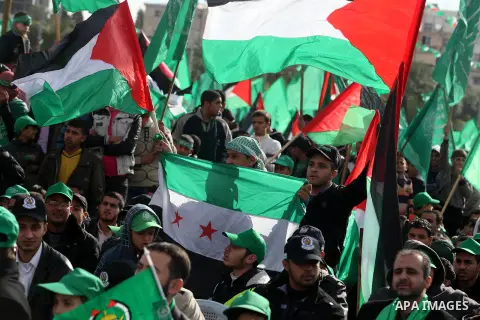 Palestinian Hamas supporters attend a Hamas rally marking the 25th anniversary of the Islamist movement's founding in Gaza City on December 8, 2012. Hamas chief Khaled Meshaal arrived to Gaza strip on December 7 during h...