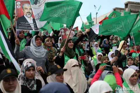 Palestinian Hamas supporters attend a Hamas rally marking the 25th anniversary of the Islamist movement's founding in Gaza City on December 8, 2012. Hamas chief Khaled Meshaal arrived to Gaza strip on December 7 during h...