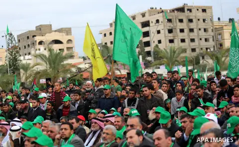 Palestinian Hamas supporters attend a Hamas rally marking the 25th anniversary of the Islamist movement's founding in Gaza City on December 8, 2012. Hamas chief Khaled Meshaal arrived to Gaza strip on December 7 during h...