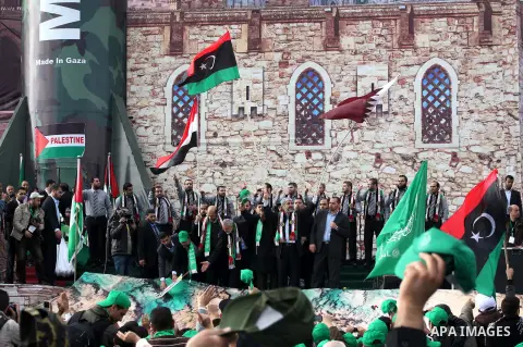 Hamas chief Khaled Meshaal, with senior Hamas leaders, takes part in a Hamas rally marking the 25th anniversary of the Islamist movement's founding in Gaza City on December 8, 2012. Meshaal arrived to Gaza strip on Decem...