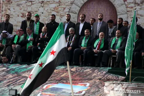 Hamas chief Khaled Meshaal, with senior Hamas leaders, takes part in a Hamas rally marking the 25th anniversary of the Islamist movement's founding in Gaza City on December 8, 2012. Meshaal arrived to Gaza strip on Decem...